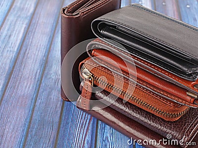 New leather multicolored wallets on blue background Stock Photo