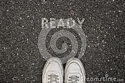 New Life Concept, Motivational Slogan with Word READY on the ground of asphalt Stock Photo