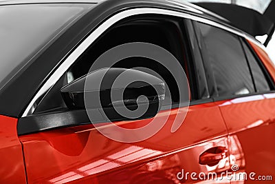 New luxury car in modern auto dealership Stock Photo