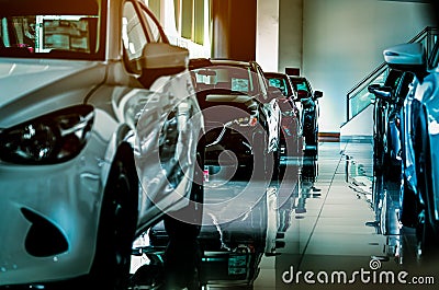 New luxury car parked in modern showroom for sale. Car dealership office. Car retail shop. Stock Photo