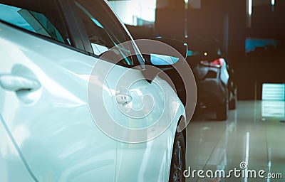 New luxury shiny SUV compact car parked in modern showroom. Car dealership office. Car retail shop. Electric and hybrid car Stock Photo