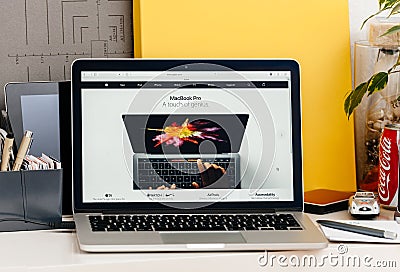 New MacBook Pro retina with touch bar human hands using oled bar Editorial Stock Photo