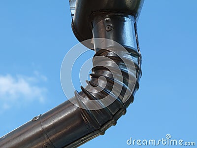 New metal rain water leader and downspout, eavestrough Stock Photo