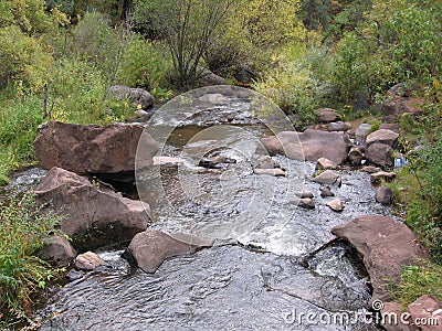 New Mexico hillside waterfalls stream whitewater river rocks wet water Stock Photo