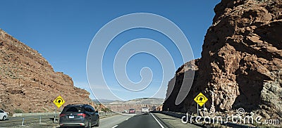 New Mexico signage of danger of roll over on a mountain highway Editorial Stock Photo