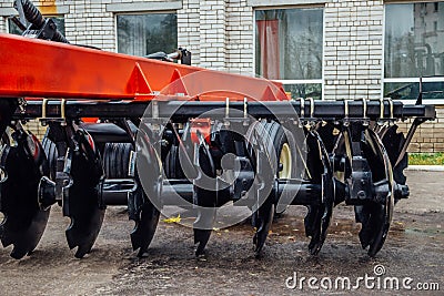 New modern agricultural disc harrow. Tillage equipment Stock Photo