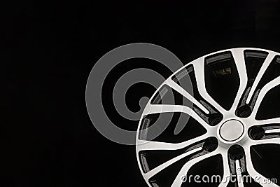 New modern alloy wheels, black with a polished front part. Close-up tuning detail, auto parts. Empty space for the copy space text Stock Photo