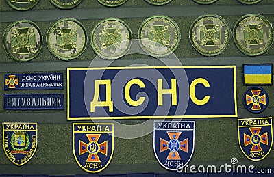 New modern chevrons of the State Emergency Service of Ukraine presented on stand. Kyiv Ukraine Editorial Stock Photo