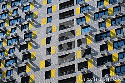New modern colored brick skyscraper house with balconies Stock Photo