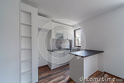 New modern and empty white kitchen. New home. Interior photography. Wooden floor. Stock Photo