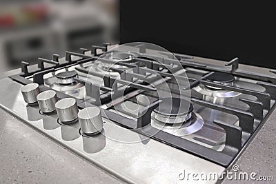 New modern gas stove with four burners for the kitchen, stainless steel surface Stock Photo