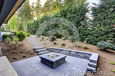 New modern home features a backyard with fire pit Stock Photo