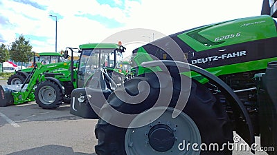 New modern tractors Deutz Fahr in agricultural machinery exhibition. Production and supply machines for farmers business. Editorial Stock Photo