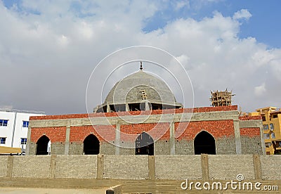 A new mosque under construction, building a new grand Masjid mosque in Cairo, Egypt, with a big dome and high minaret, wooden Stock Photo