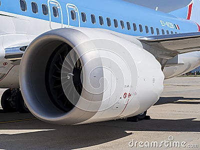Neos Boeing 737 Max 8. Close-up to the engine of the passenger plane waiting for departure Editorial Stock Photo