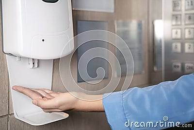 New normal for auto alcohal feeder machine in elevator Stock Photo