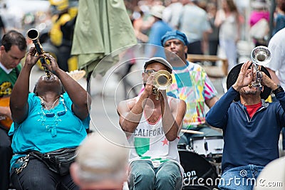 NEW ORLEANS - APRIL 13: In New Orleans, a jazz band plays jazz melodies in the street for donations from the tourists Editorial Stock Photo