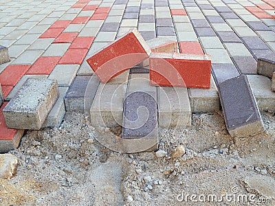 New pavement laying with rectangular paving slabs of gray, blue and red colo Stock Photo