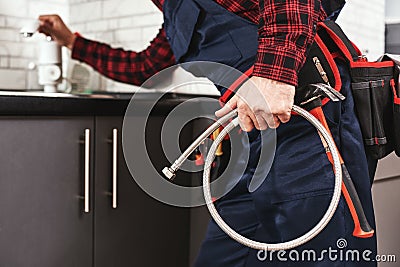 New plumbing. Close-up of foreman checking all things before start faucet Stock Photo