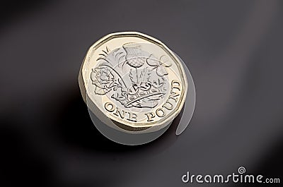 New pound coin on dark background Editorial Stock Photo