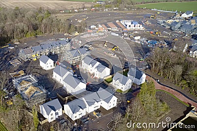 New private housing development construction in rural countryside aerial view Stock Photo