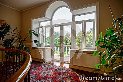 New pvc windows in old-styled interior Stock Photo