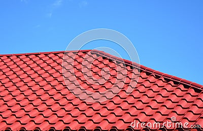 New red metal tiled roof house roofing construction exterior. Stock Photo