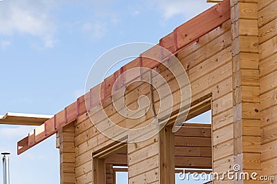 New residential construction home framing against a blue sky. Stock Photo