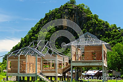 New residential construction house framing against a blue sky an Stock Photo