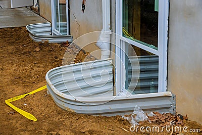 Building materials window well for basement construction Stock Photo