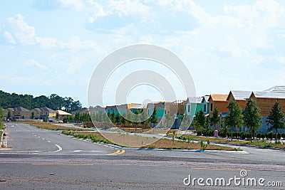 New residential neighborhood under construction with half built homes and newly planted trees in South Florida to address a Stock Photo