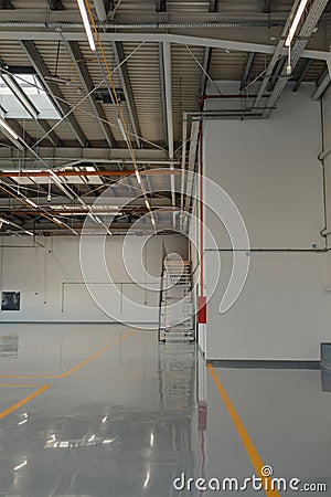 New resin floor coating and marking signs in a car workshop Stock Photo