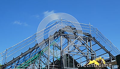 New roof on commercial Building under construction and blue sky Editorial Stock Photo