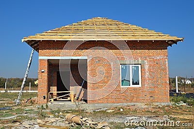 New Roof Membrane Coverings with Wooden Construction Home Framing with Roof Rafters Outdoor Stock Photo