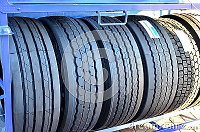 New rubber tire with tread for trucks and special construction wheeled vehicles for driving on asphalt roads and off-road Stock Photo