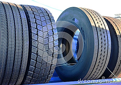 New rubber tire with tread for trucks and special construction wheeled vehicles for driving on asphalt roads and off-road Stock Photo