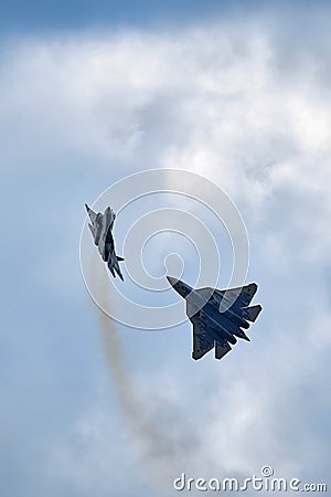 New Russian five generation's fighters SU 57, T-50 shows aerial maneuver battle at Moscow International Aviation and Editorial Stock Photo