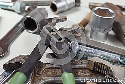 New and rusty wrenches, nuts, bolts and nuts for mechanical work closeup Stock Photo