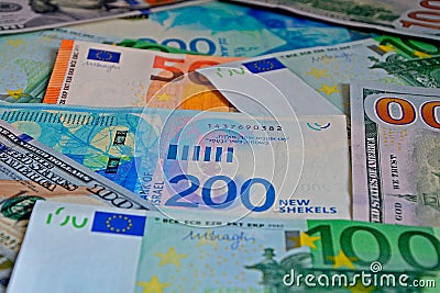 New series of Israeli shekels, the euro and US dollars. Money background, bills 50, 100, 200, closeup, Selective focus Stock Photo