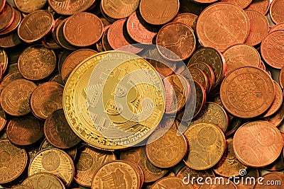 New shiny Bitcoin laying on a pile of old copper coins Stock Photo