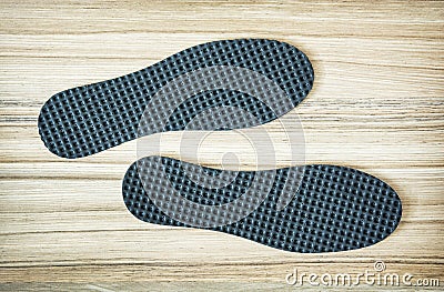 New shoe insoles on the wooden background Stock Photo