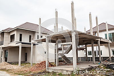 A new stick built home under construction. construction residential new house in progress at building site. Stock Photo