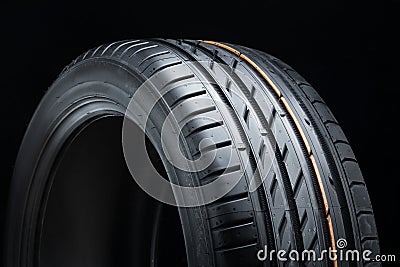 new summer tire, tread close-up on black background Stock Photo