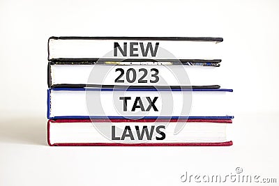 New 2023 tax laws symbol. Concept words New 2023 tax laws on books. Beautiful white table white background. Business new 2023 tax Stock Photo