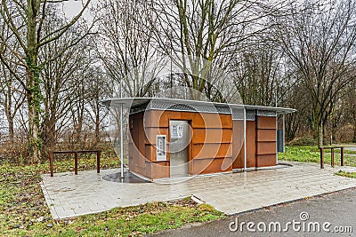 Corten steel toilet block and equipped with payment machine Editorial Stock Photo