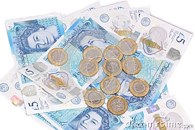 The new UK polymer five pound note and the new 12 sided Â£1 coin Editorial Stock Photo
