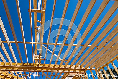 A new under construction beam frame has been framed for purpose of framing floor joist truss in laying second floor new Stock Photo