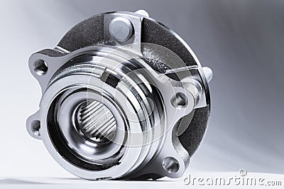 New Wheel hub assembly with bearing. This is part of the car suspension on a gray background with a gradient. The Stock Photo