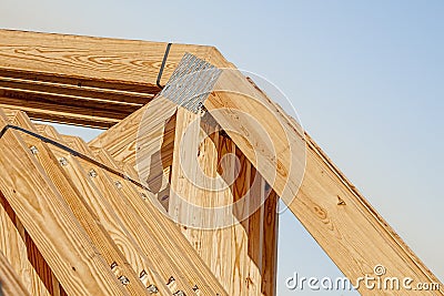 New wood pine trusses with metal joist hangers attached Stock Photo