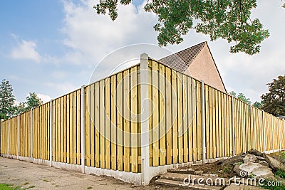 New wooden fence at garden of house Stock Photo